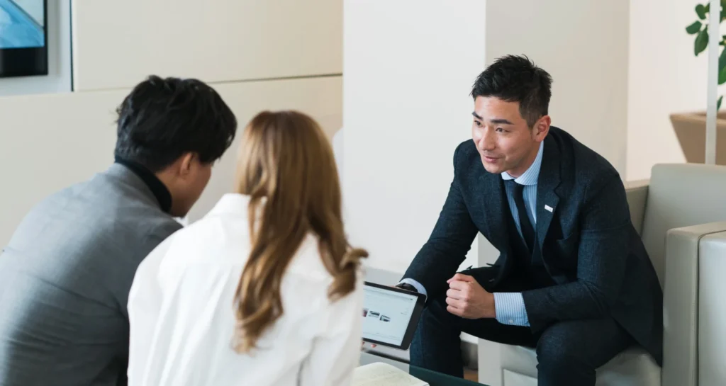 Foreigners Buying cars in Japan at a Dealership. 